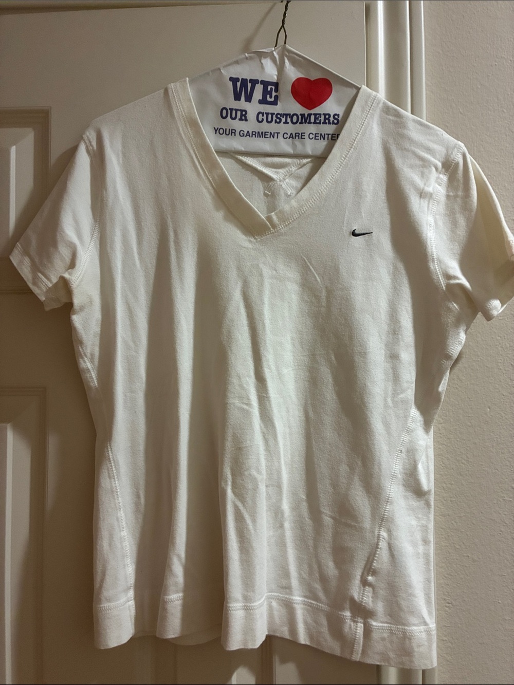 Nike Women’s White Short Sleeve V‑Neck Tee